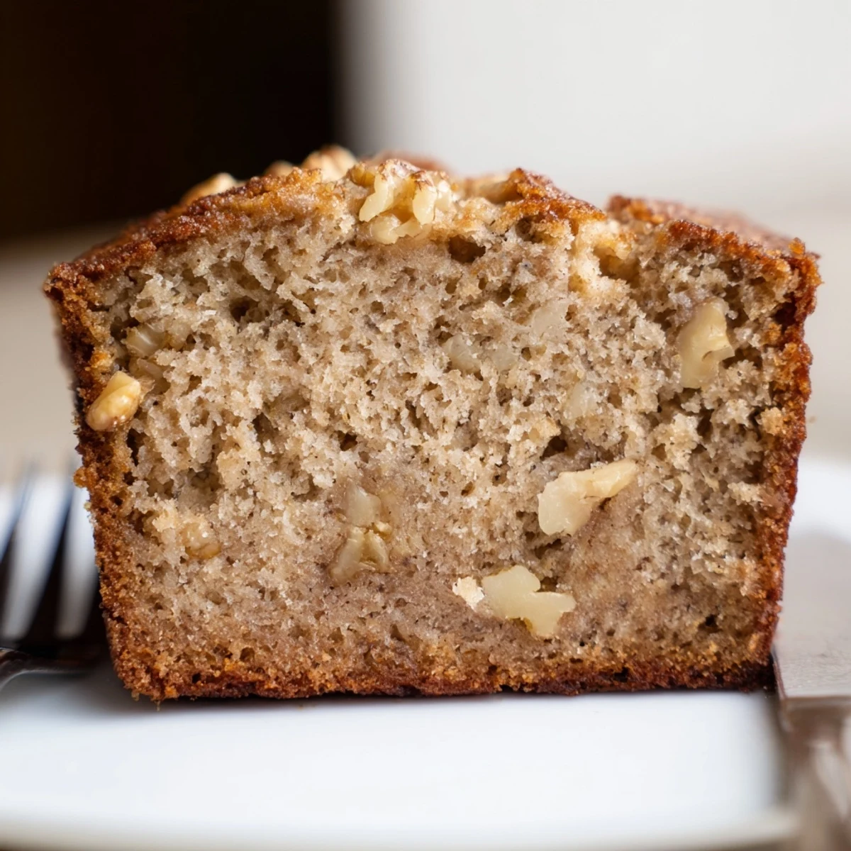 Freshly baked Simple Banana Bread, ideal for breakfast or a sweet snack with a cup of coffee.