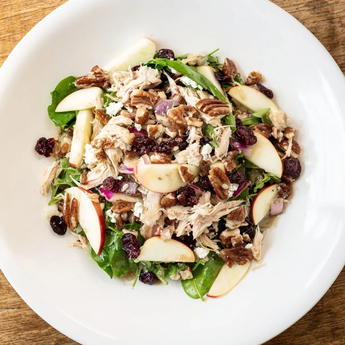 Chicken and Apple Winter Salad boasts colorful apples, tender chicken, and a zesty apple cider dressing.