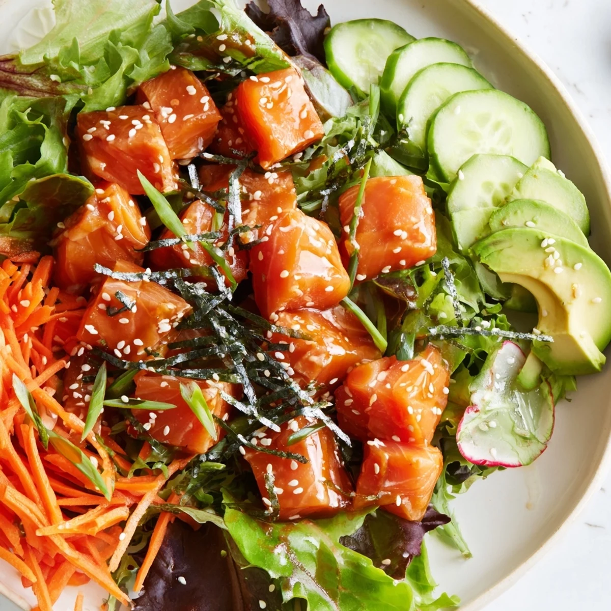 Fresh, vibrant poke bowl salad loaded with marinated fish, avocado, and crunchy veggies.