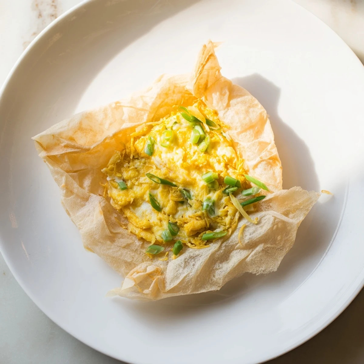 Golden brown Rice Paper Egg & Cheese Fold, a quick & easy breakfast snack with melted cheese inside.