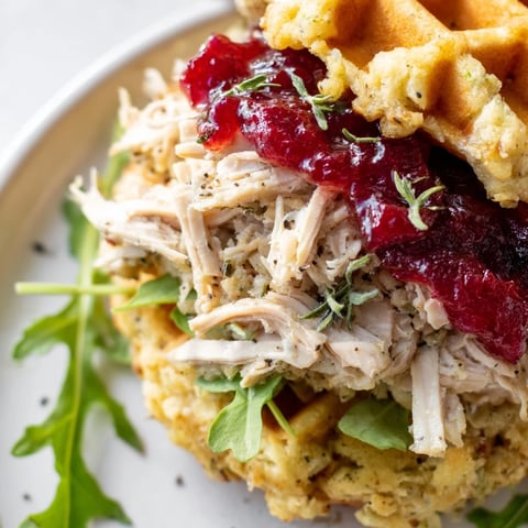 Golden, crispy stuffing waffle chicken sliders, piled high with shredded chicken, a festive autumn meal.