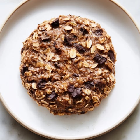 Freshly baked chocolate oatmeal breakfast cookies, a healthy, grab-and-go morning treat with visible chocolate chips.