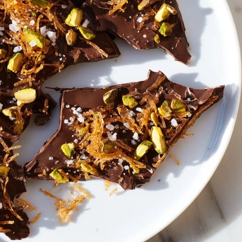 Golden Kataifi Chocolate Crunch Bark, a delightful treat with rich dark chocolate, flaky kataifi, and crunchy pistachios.