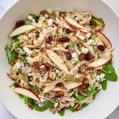 Enjoy this Chicken and Apple Winter Salad with vibrant greens and crunchy pecans, perfect for a cold day.