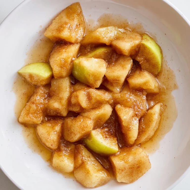 A close-up of fragrant Baked Apple Slices with Cinnamon and Brown Sugar, ready to serve warm.