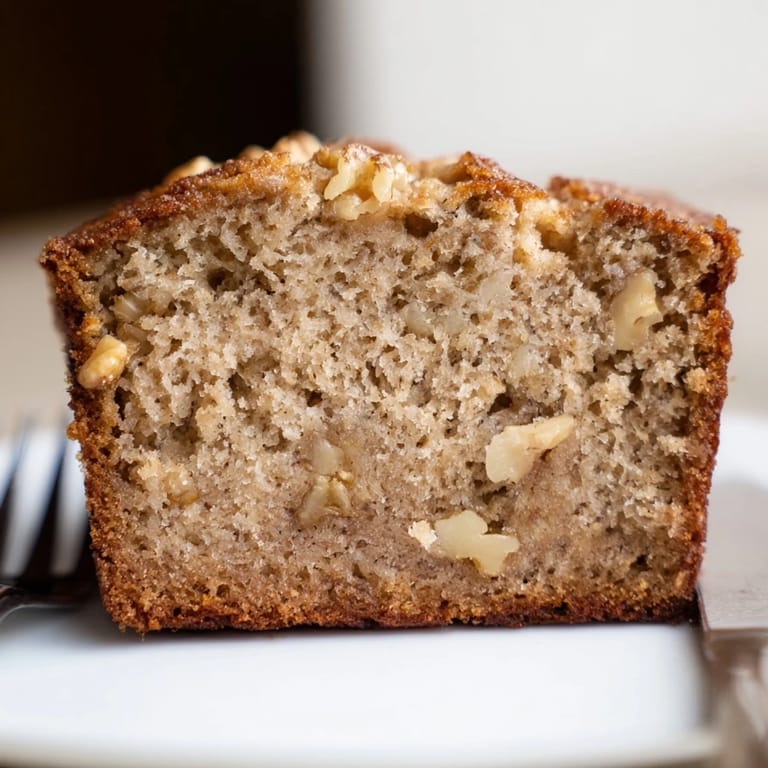 Freshly baked Simple Banana Bread, ideal for breakfast or a sweet snack with a cup of coffee.
