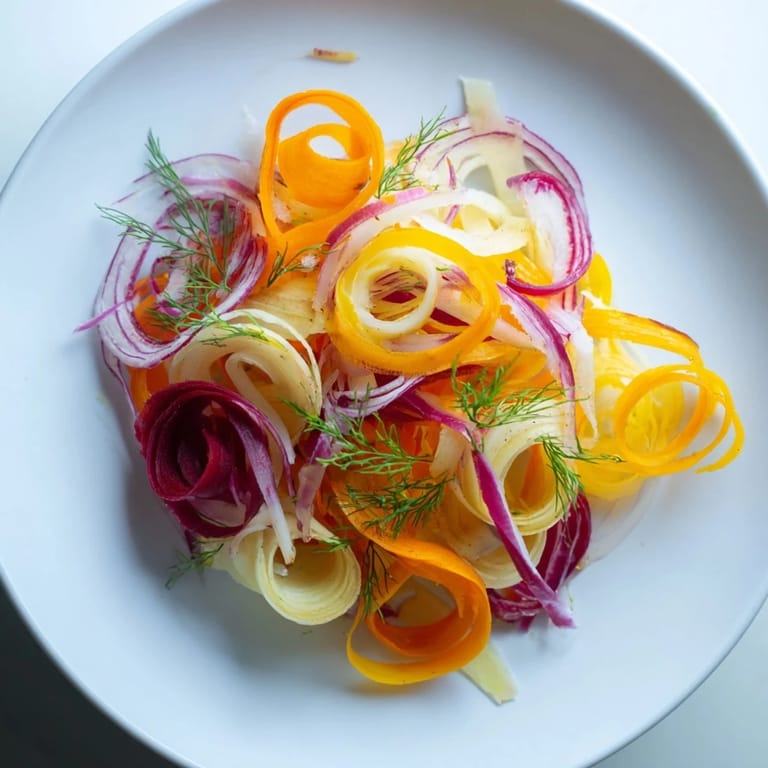 Visualize the refreshing The Spinning Top salad, glistening with light dressing, perfect for a summer gathering.