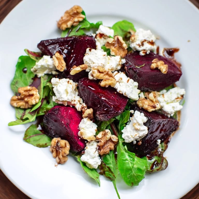 This delightful Beet and Goat Cheese Salad, ready to eat, includes a tangy balsamic drizzle.