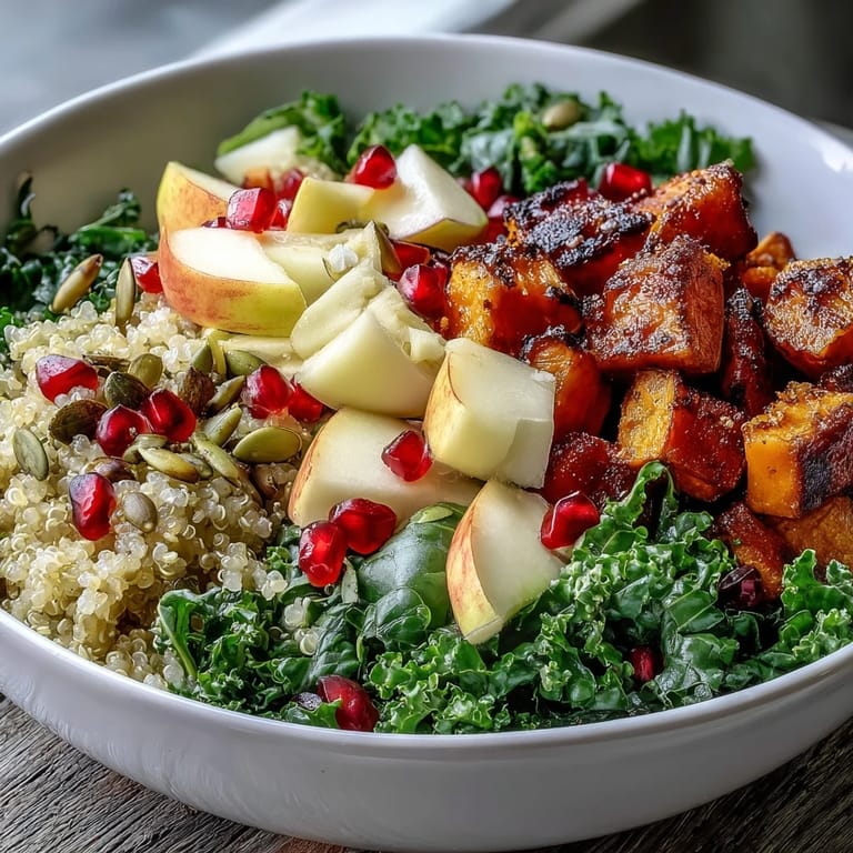 The vibrant Kale Harvest Grain Bowl features golden roasted sweet potatoes, crisp apple, and crunchy pepitas for texture.
